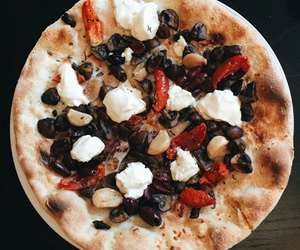 flatbread pizza with olives, red peppers and goat cheese
